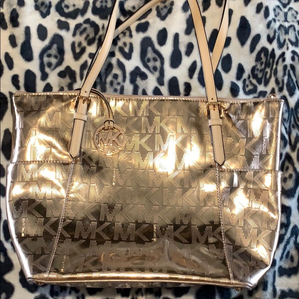 Used rose gold Micheal Kor handbag